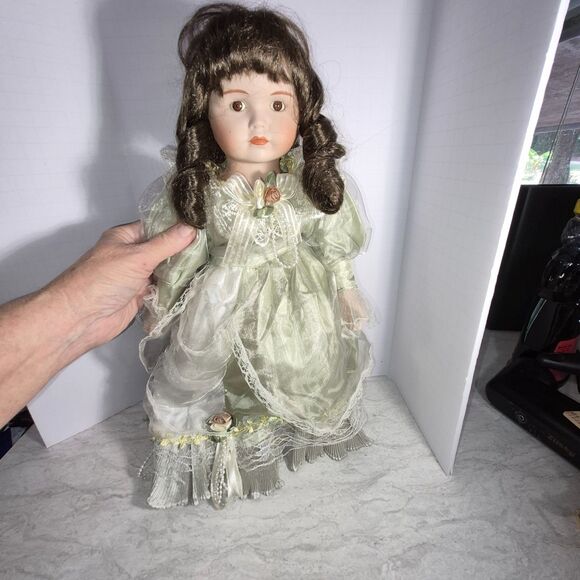 Heirloom Treasure Doll, Dark Long Curley Hair with Green Dress and Bow on Front - Picture 2 of 10